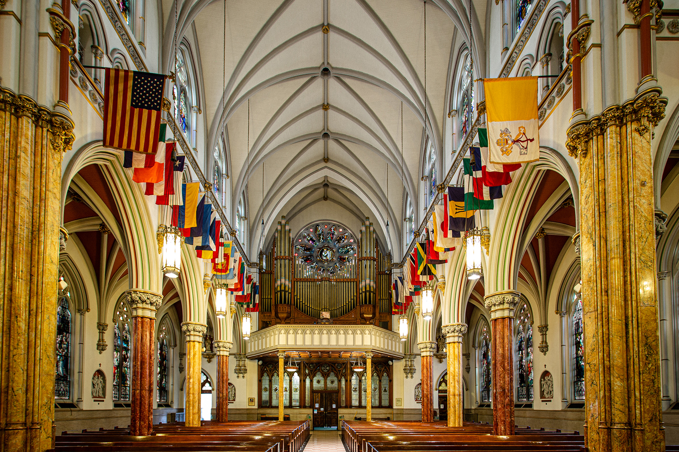 lamps and flags hanging in St. Francis Xavier church in Park Slope, Brooklyn